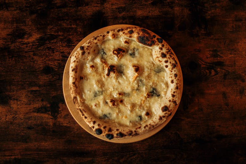 Anthony's coal fired spicy sausage and broccoli rabe pizza
